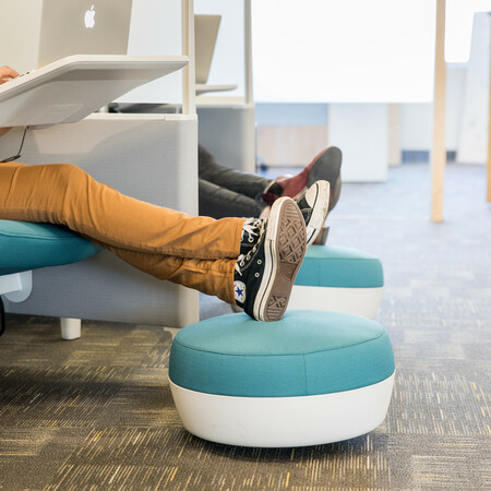 two of our team working hard in the pods - photo shows just their feet resting on two little foot rests